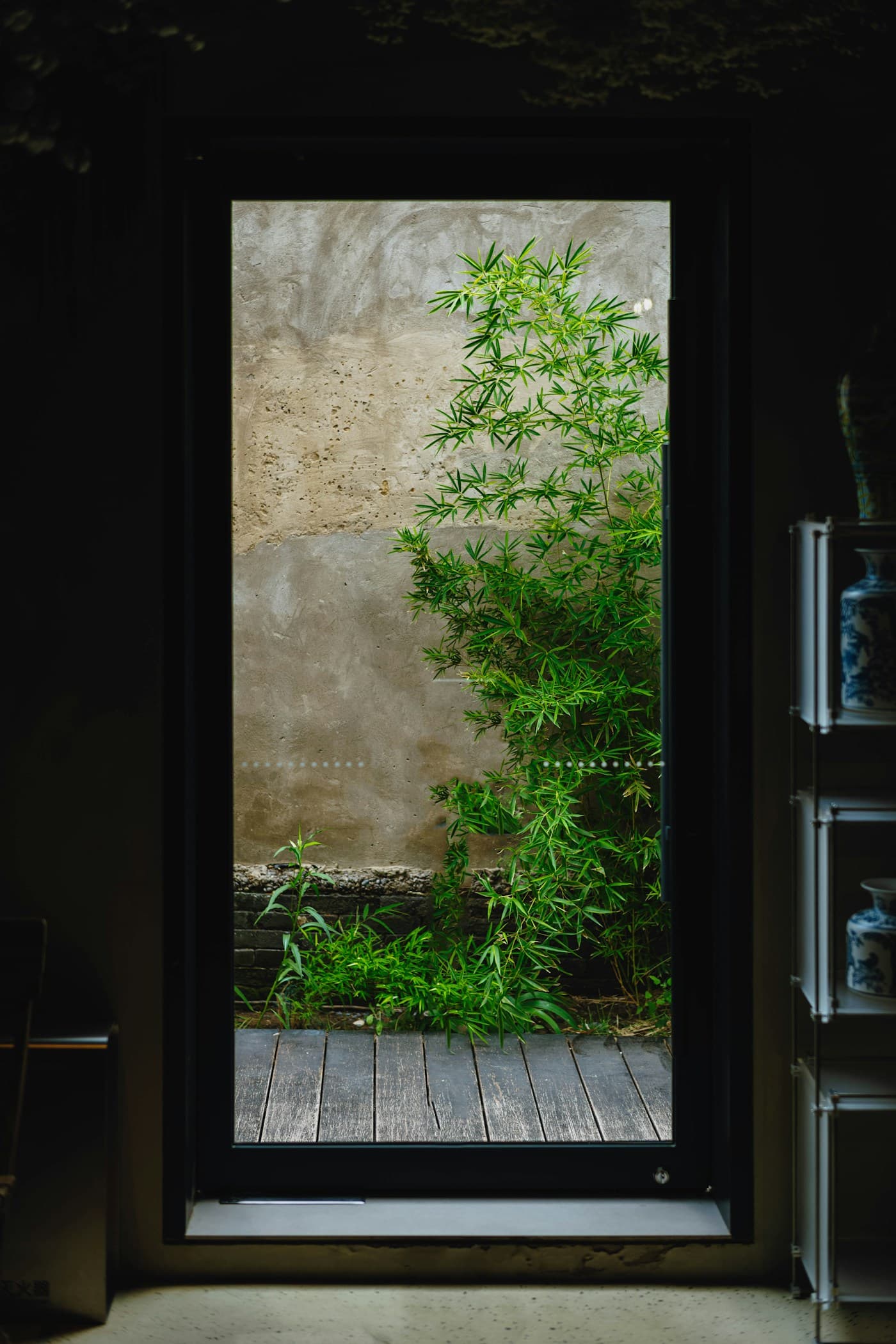 Architecture framing a quiet planted court