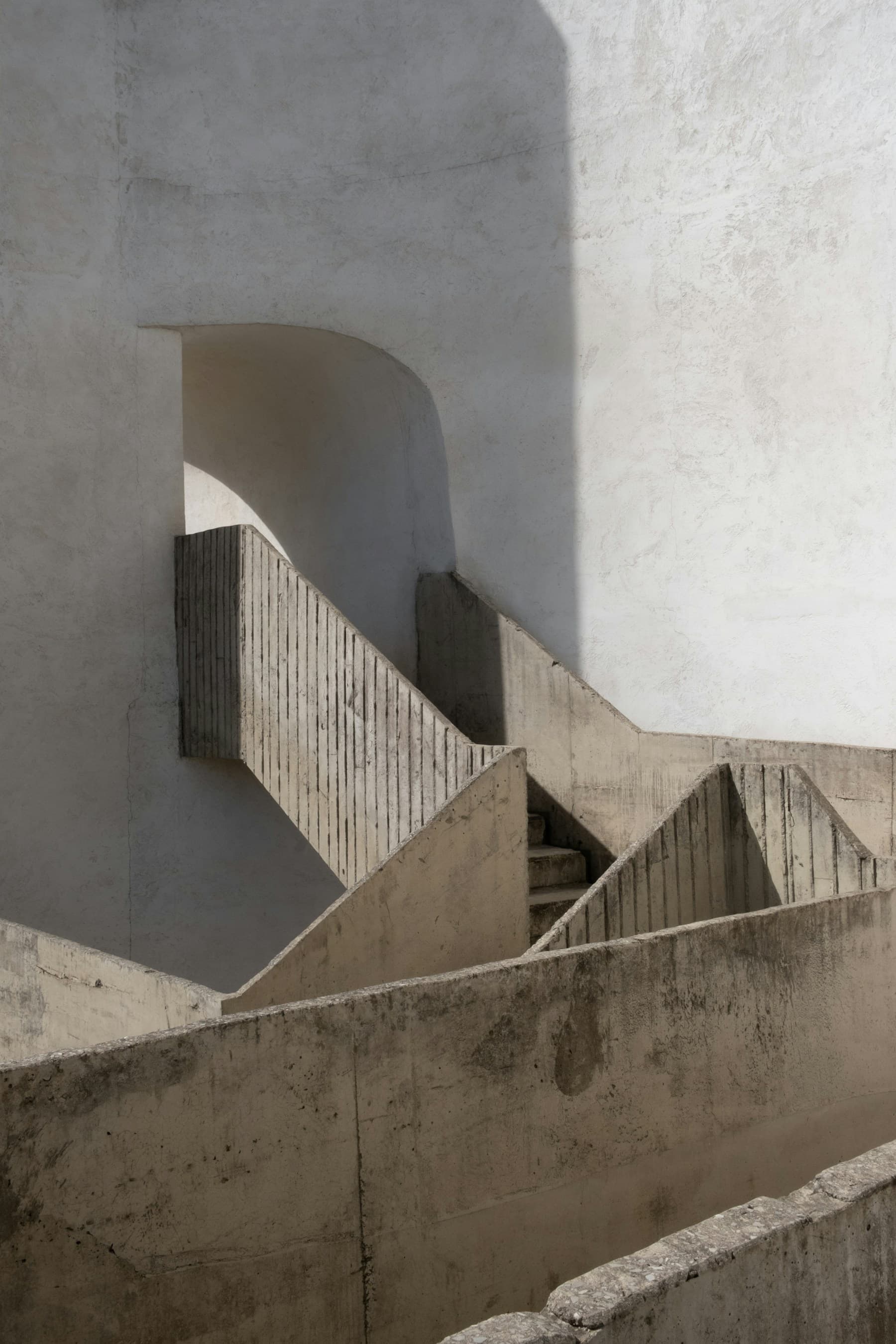 Sunlight drawing a precise line across textured concrete